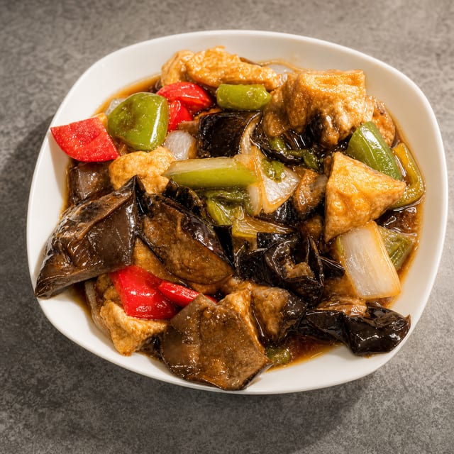 F11. Stir Fried Eggplant with Basil.